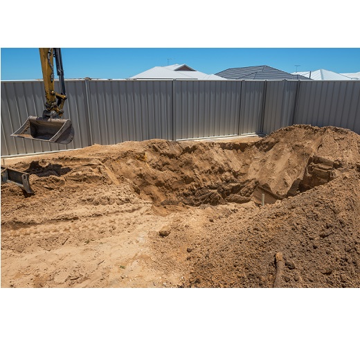 Excavation works for the installation of a swimming pool.Swimming pool under construction.